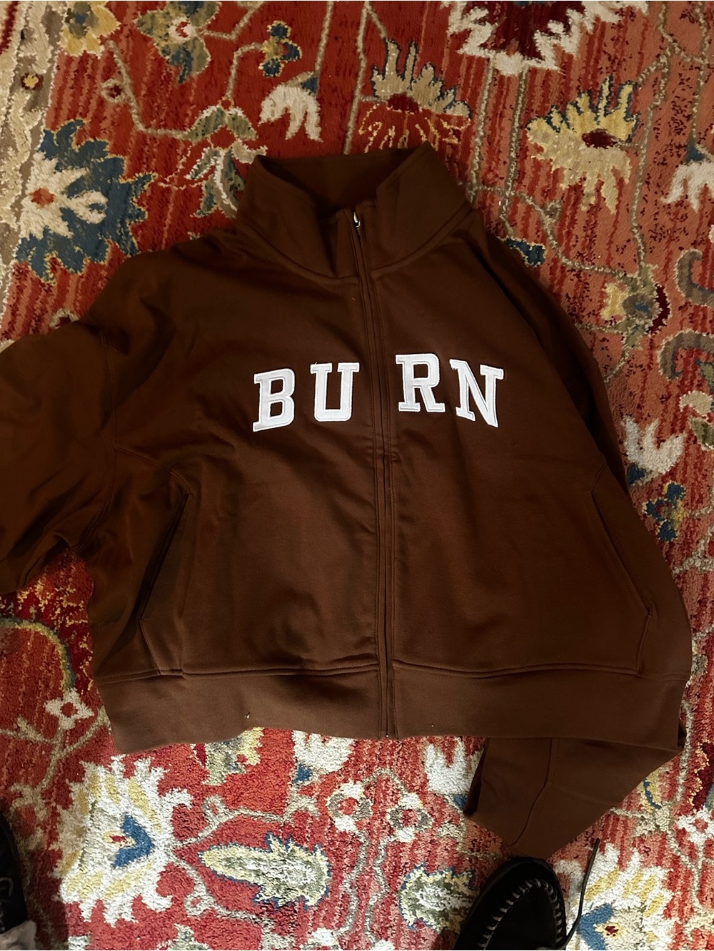 Brown Zip-Up Jacket with 'BURN' Lettering